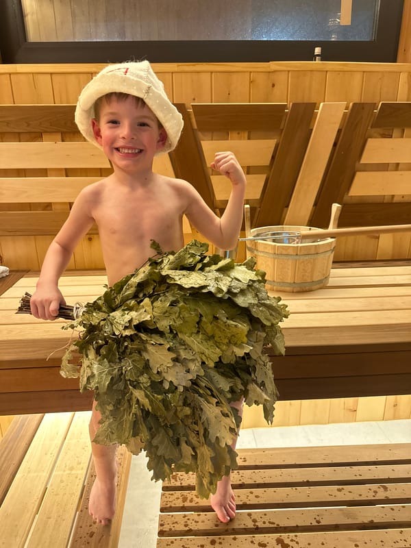 Boy enjoys traditional Russian banya sauna experience