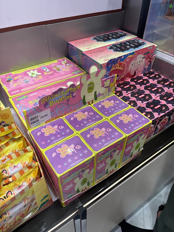 Shopper documents toy collectibles at West Jakarta mall
