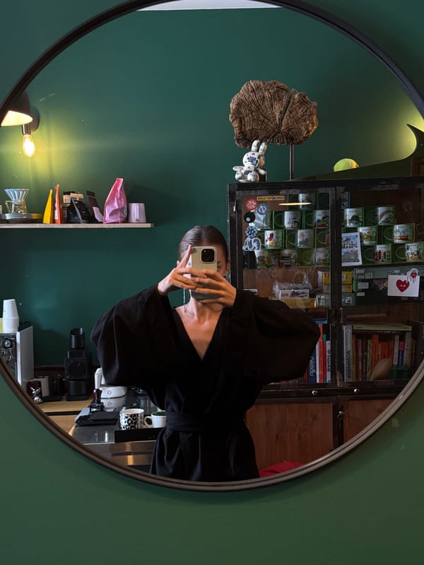 Inside a green-walled Odesa café, morning coffee and plants