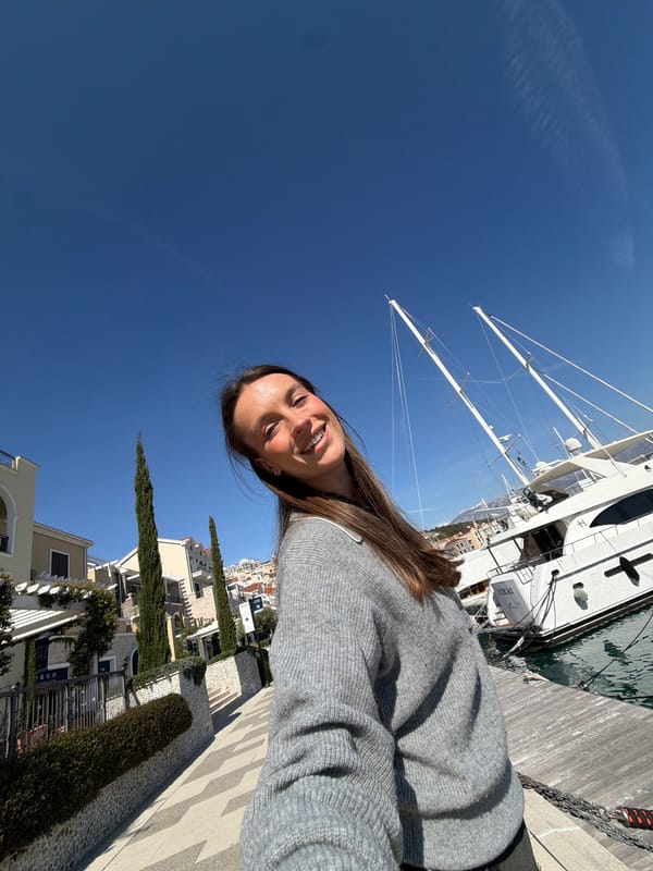 Woman visits marina, takes selfies in Radovići, Montenegro