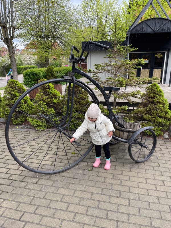 Child plays with public art sculptures in Zelenogradsk