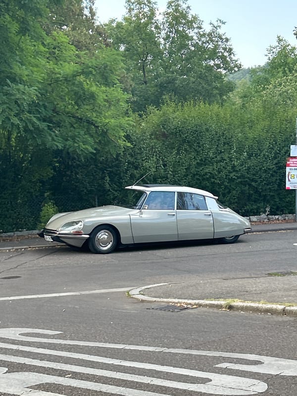 Vintage Citroën DS parked, two angles, August 2026