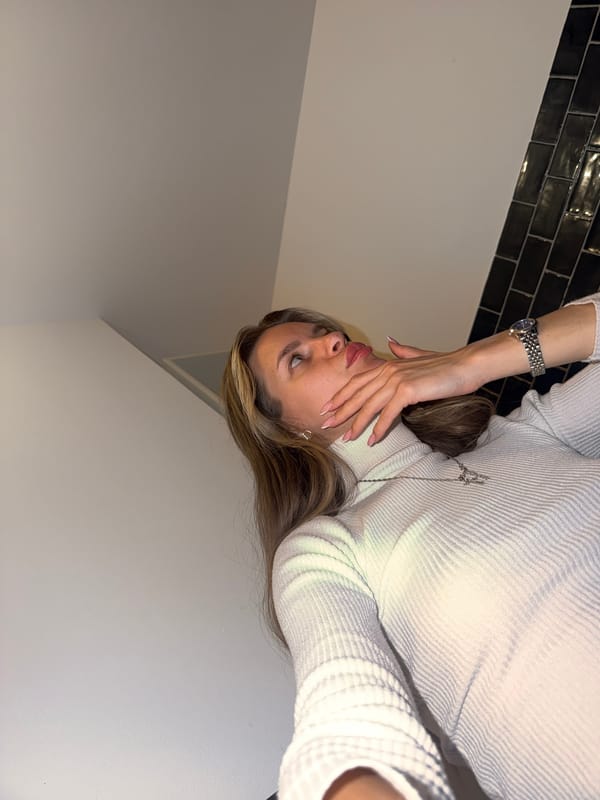 Woman in white sweater observed resting in Berlin