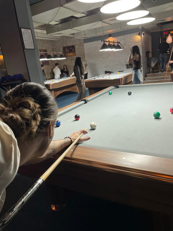 Pool player focused on shot in Burgas room