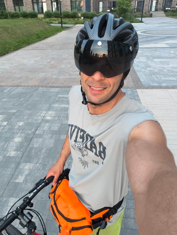 Cyclist takes selfie with bike in Moscow paved area
