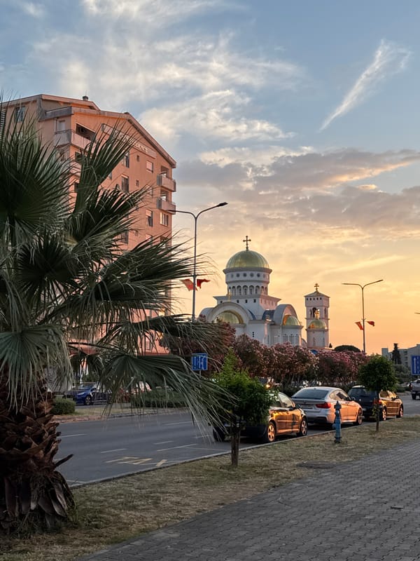 Sunset stop in Bar, Montenegro with an adventure bike in tow