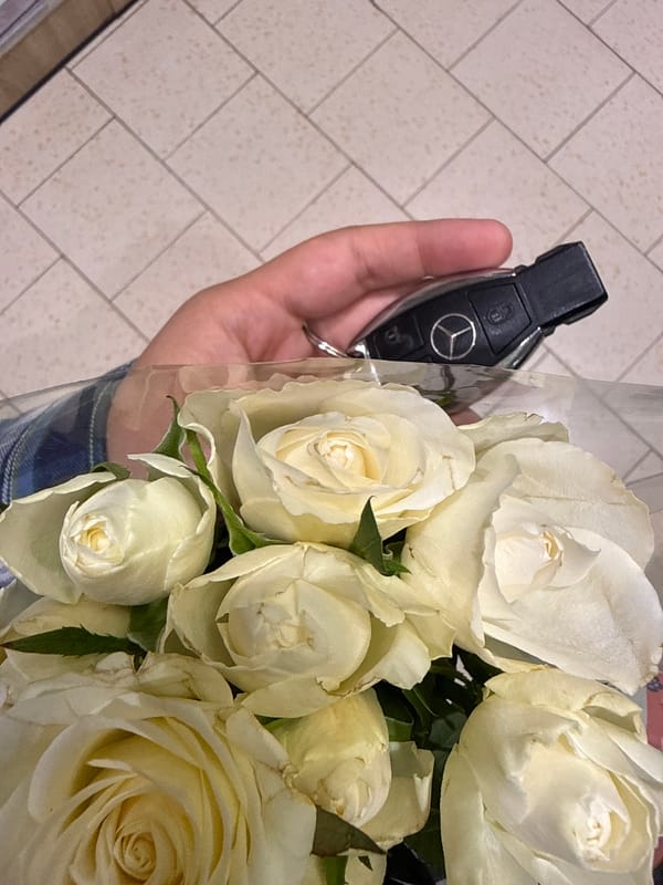 Person holds Mercedes key, white roses in Pazardzhik