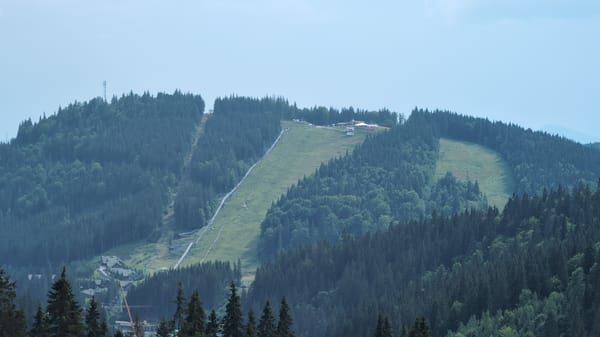 Mountain resort with ski slope and A-frame lodge structures