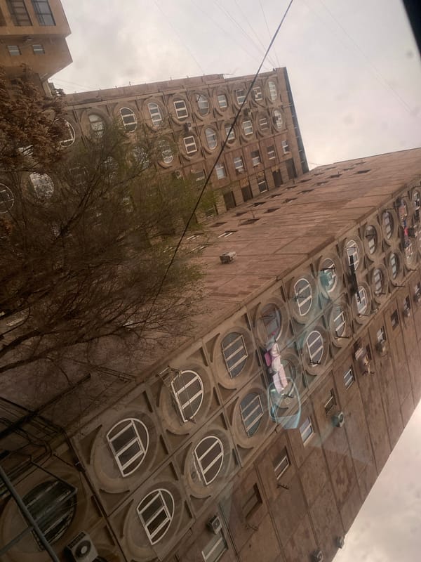 Soviet-era apartment building with circular windows documented in Yerevan