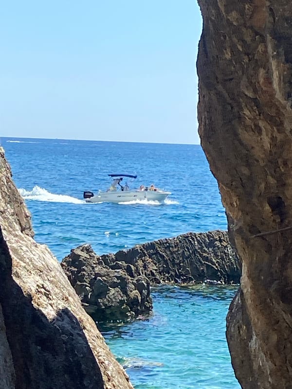 Rocky Adriatic coastline with boats, Montenegro