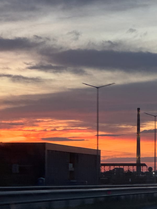 Sunset observed over Asenovgrad, Bulgaria with wind turbines visible