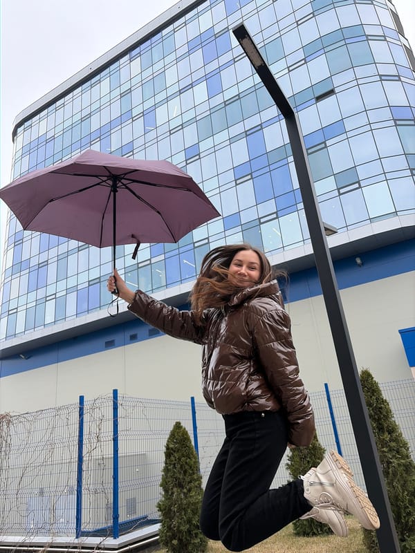 Woman with purple umbrella spotted near building in Izhevsk