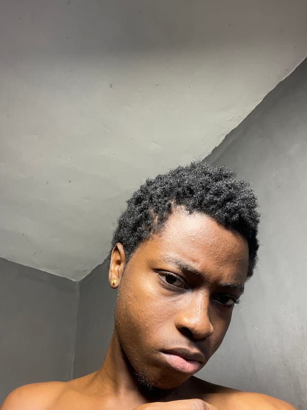 Young man photographed smoking indoors in Nkpor, Nigeria