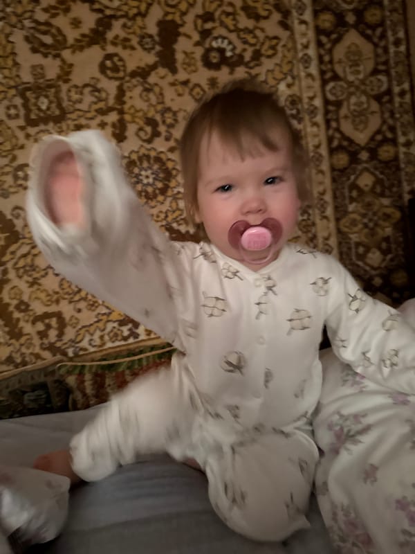 Baby rests on rug in Krapivka, Russia