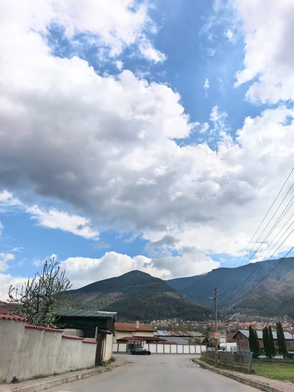 Urban street scenes with mountains captured by witness