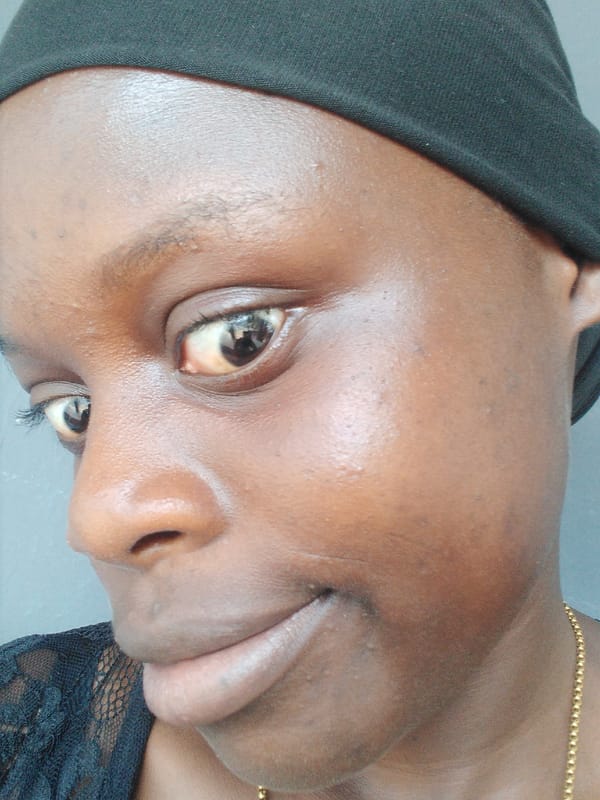 Portrait of woman in black head covering captured