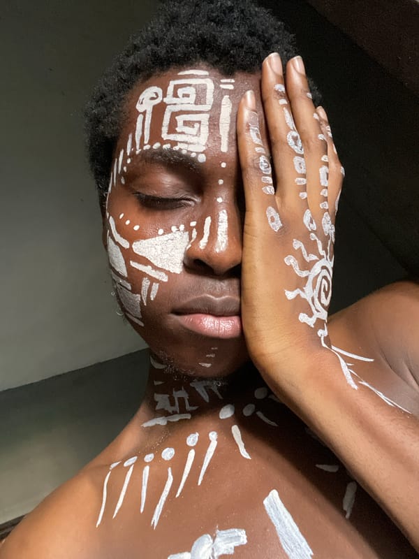 Person captured in contemplative pose in Onitsha, Nigeria