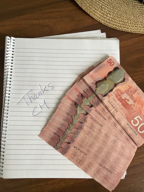 Person handles Canadian cash in Montreal residential setting