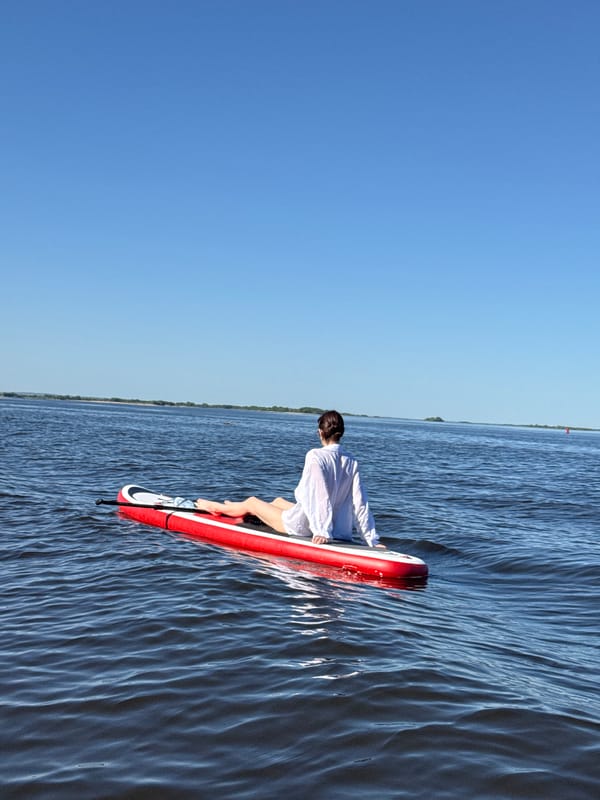 Paddleboarders enjoy clear afternoon on Russian waters near Ust'-Kurdium