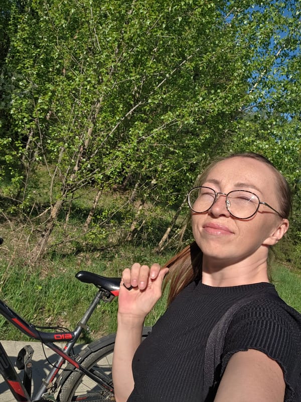 Woman with bicycle spotted outside residential building in Chaikovsky