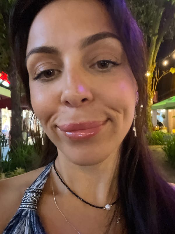 Evening streetscape with lanterns and shops documented in Indonesia