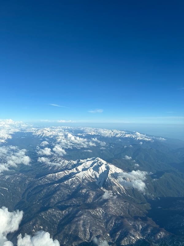 Aircraft captures aerial views of snowy mountains near Khimki