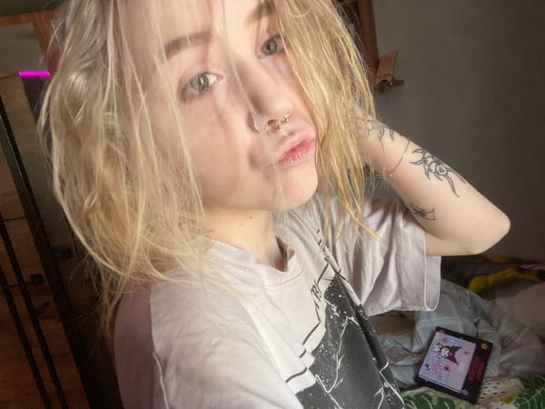 Young woman documents morning routine with cat in Izhevsk