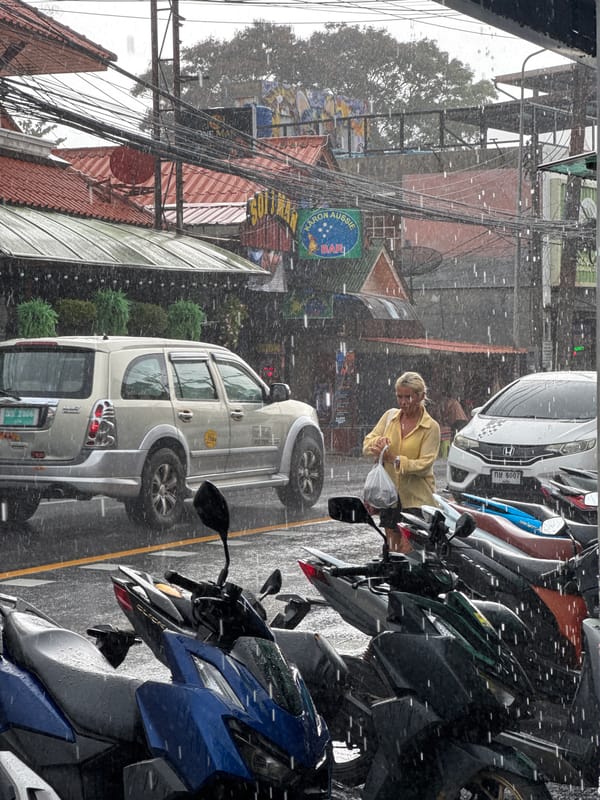 Karon street life during a morning rain shower, Phuket