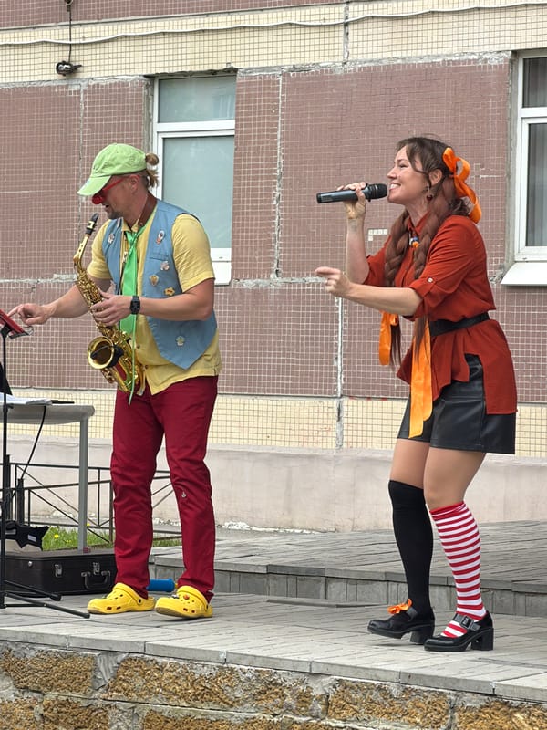 Street performers entertain outside building in Saint Petersburg
