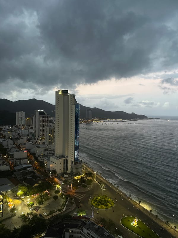 Tourist documents Nha Trang Cathedral and beach scenes under cloudy skies