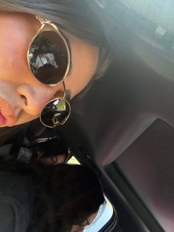 Woman takes selfies, drinks La Croix during Mexico City car ride