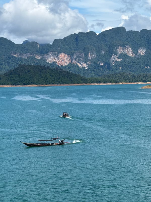 Cheow Lan Lake's turquoise waters and jungle mountains, Ban Ta Khun