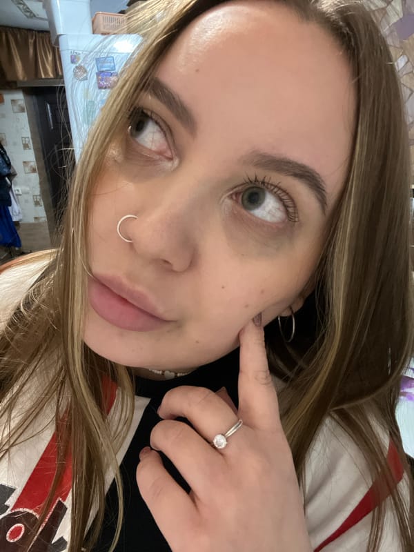 Young woman takes multiple selfies at home in Russia
