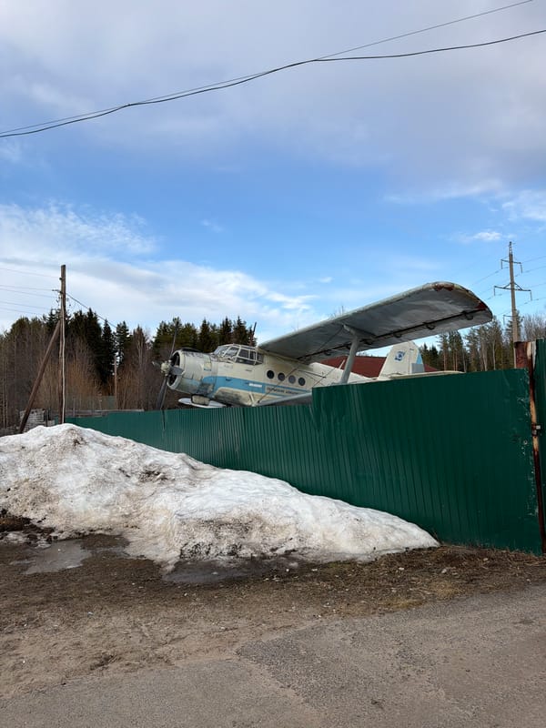 Antonov An-2 biplane spotted behind fence in Жуланово, Russia