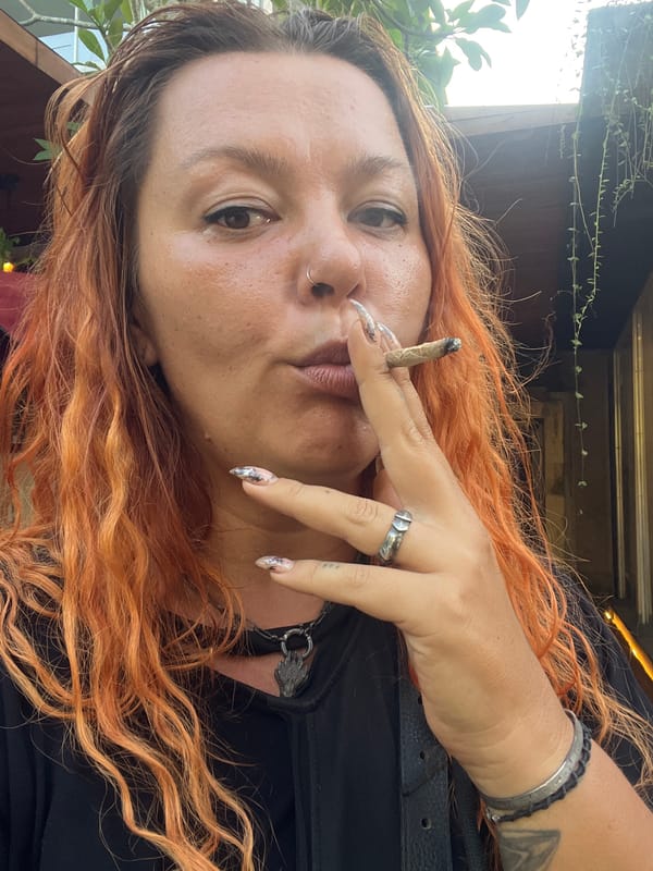 Casual street scene captured in Ubud: smoker and delivery driver