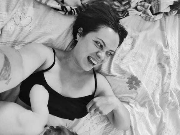 Rainbow light captures quiet domestic moment with mother and baby