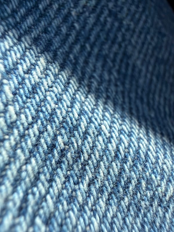 Close-up of denim fabric weave captured in Varna