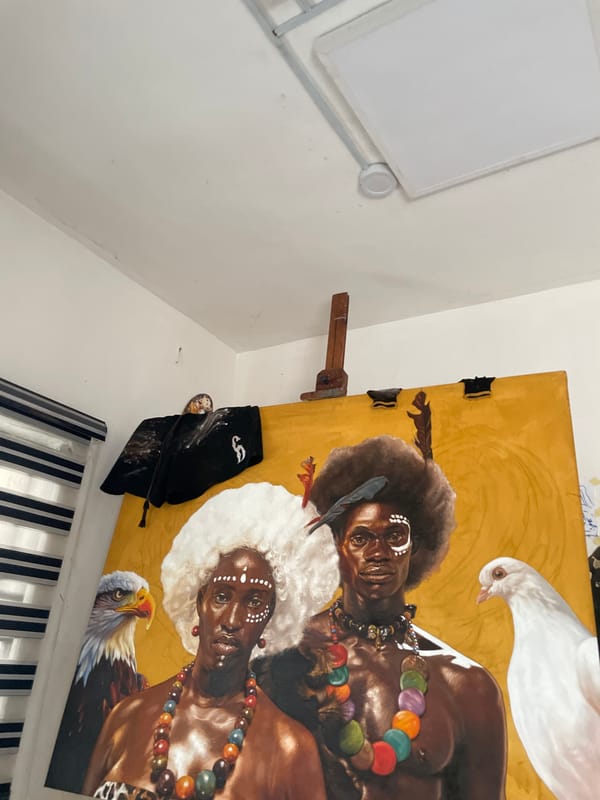 Artist workspace with traditional portrait painting observed in Ado