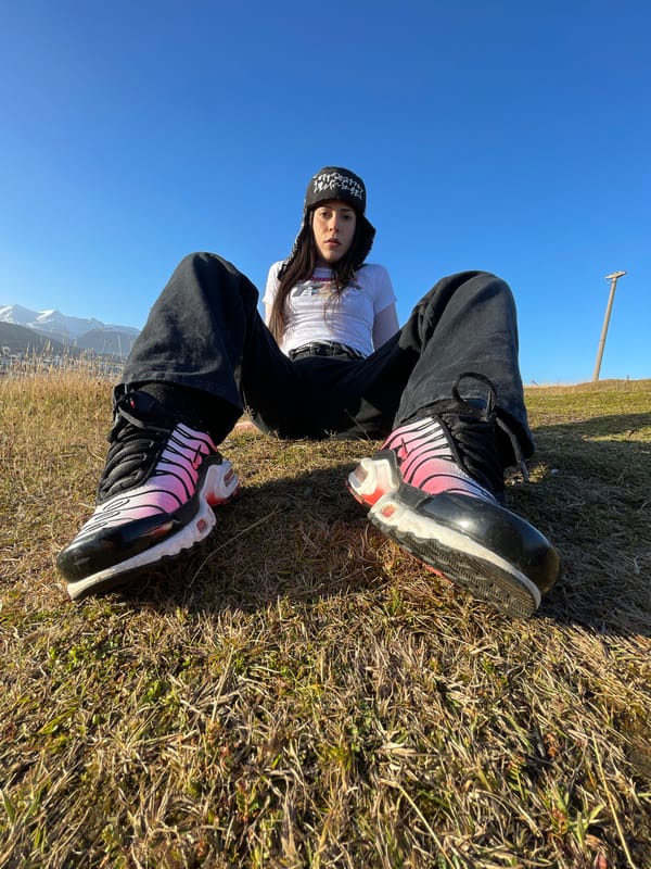Woman rests on grass in Ushuaia, Argentina
