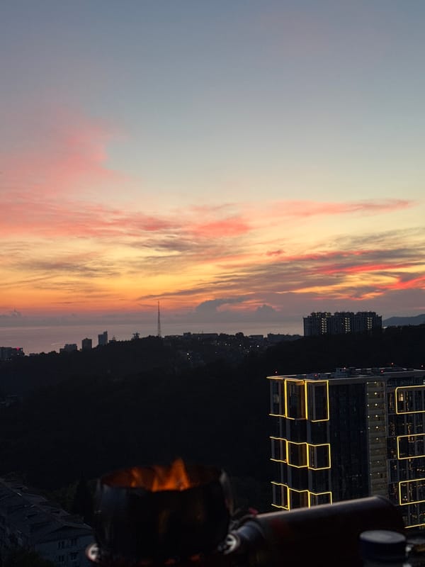 Sunset views over Sochi with barbecue and cityscape