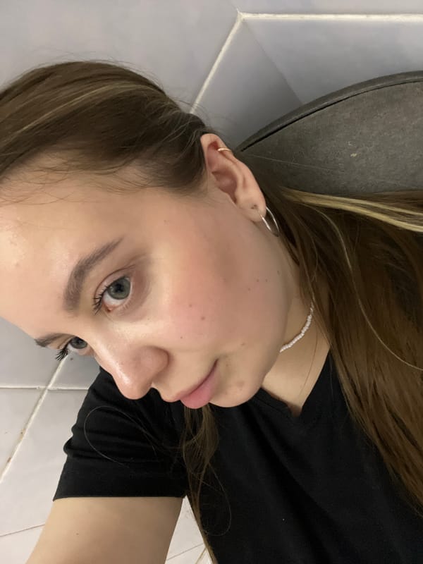 Woman takes multiple selfies in Novopokrovskaya home