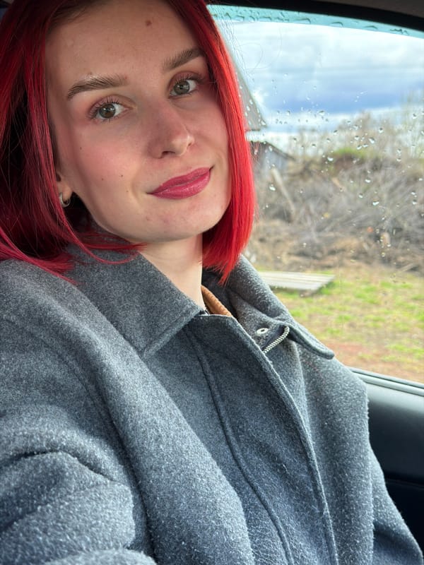 Red-haired woman photographed in casual moments in Chaikovsky