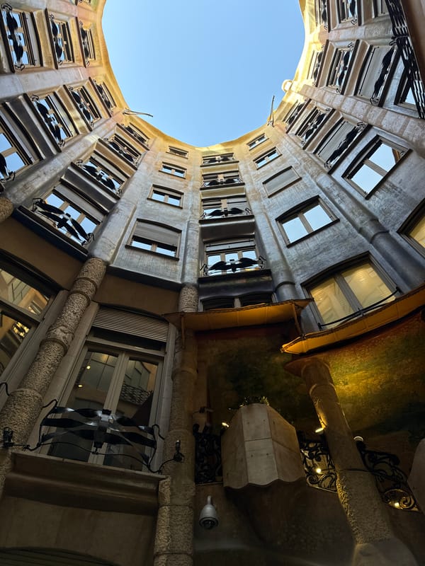 Tourist documents Casa Batlló interior rooms during Barcelona visit