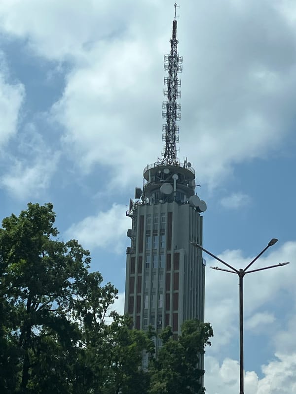 Skyscraper and open highway on a sunny day