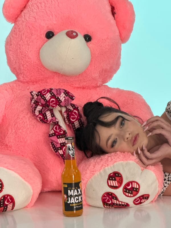Woman poses with teddy bear, beverage in Yerevan morning shoot