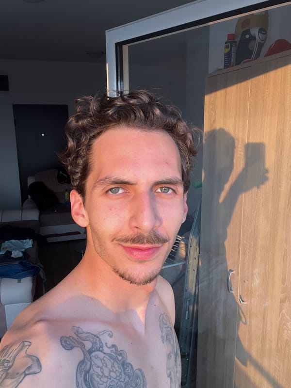 Tattooed man takes selfies in Montenegro coastal resort area