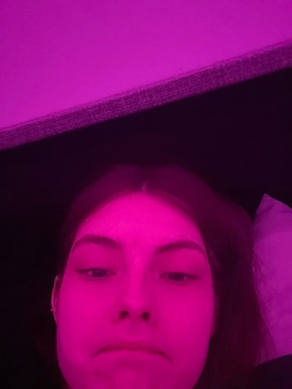 Person photographed with colored lighting in Saint Petersburg apartment