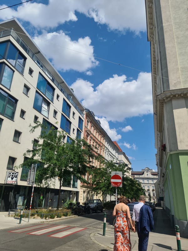 Street-level Vienna: facades, foot traffic, and a sunny afternoon