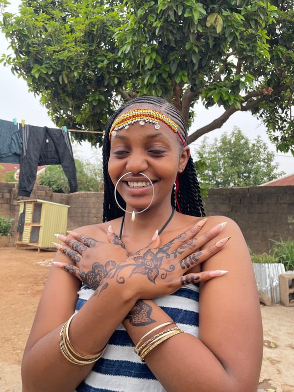 Woman photographed in traditional jewelry during outdoor portrait session