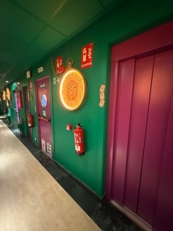 Woman takes selfies in colorful Madrid rooms